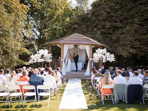 Outdoor wedding ceremony at That Amazing Place Wedding Venue Old Harlow Essex