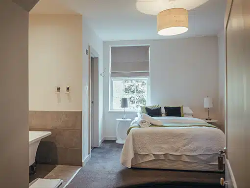Bedroom with bath at That Amazing Place Essex Wedding Venue with Accommodation