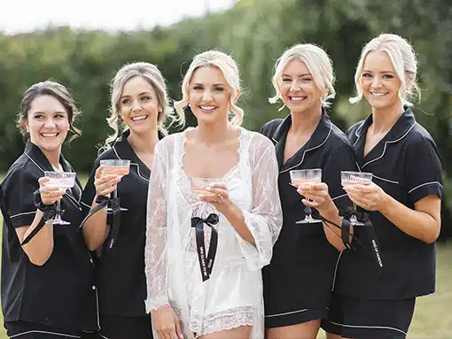 Wake up ready for ‘I do' Bride and bridesmaids in pajamas at That Amazing Place Essex Wedding Venue with accommodation
