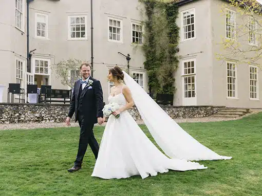 Bride and groom at That Amazing Place Essex Wedding Venue walking in gardens