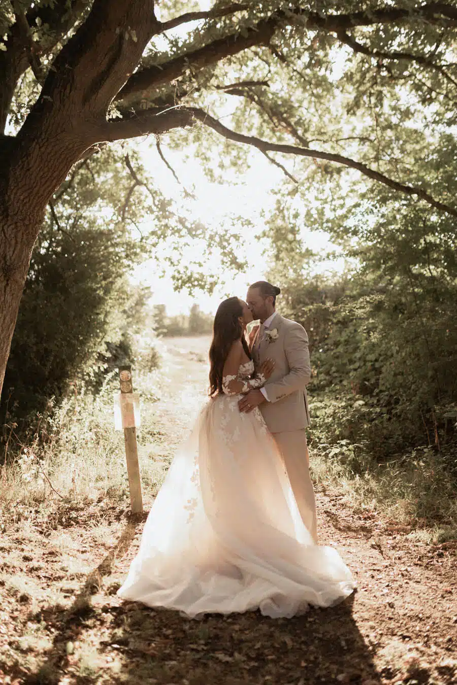 Bride and groom in grounds field at That amazing Place Essex Wedding Venue