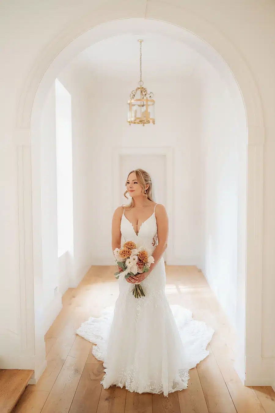 Bride inside hallway house at That Amazing Place Essex Wedding Venue