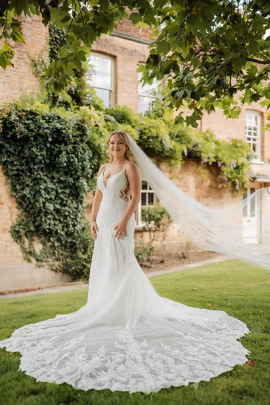 Bride outside side of house of That Amazing Place Essex Wedding Venue with accommodation