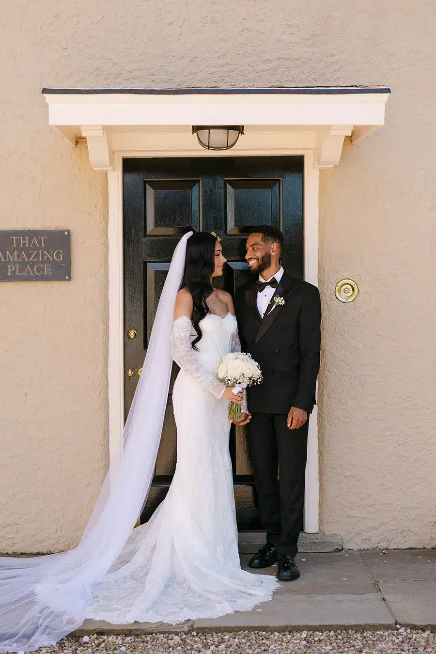 Tanya & JP at front door of That Amazing Place Essex Wedding Venue by Jessy Pappasavva Photography